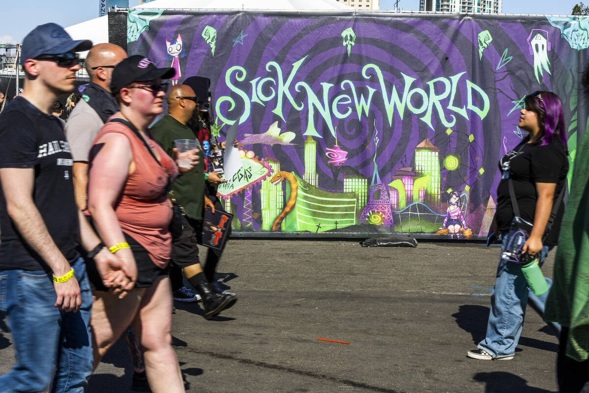Attendees walk along during the Sick New World festival at the Las Vegas Festival Grounds on Sa ...