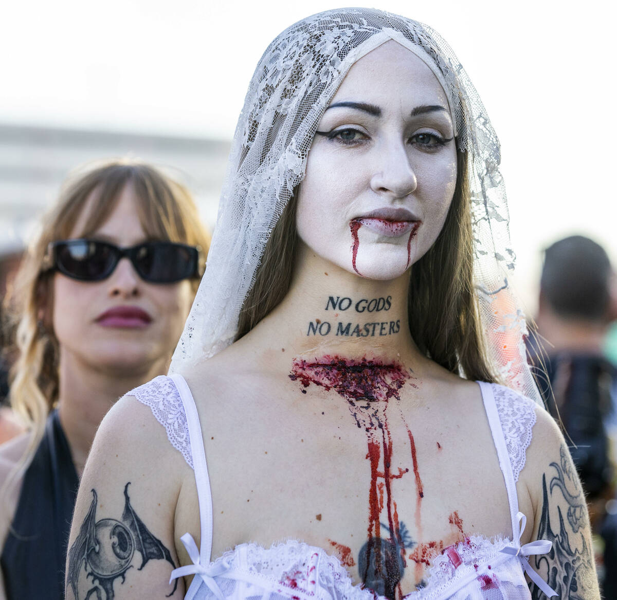 An attendee listens as Skinny Puppy performs during the Sick New World festival at the Las Vega ...