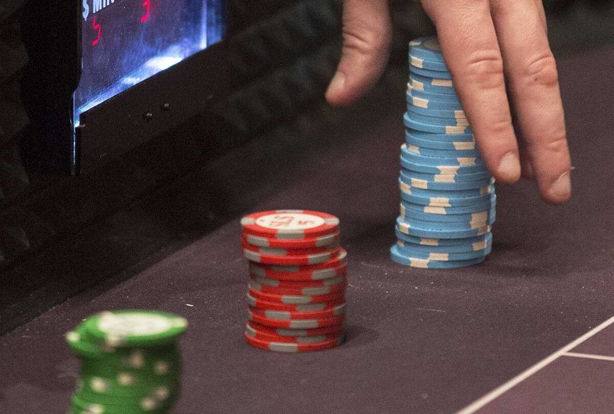 A dealer moves a stack of chips on the craps table at SLS Las Vegas on Thursday, May, 30, 2019, ...