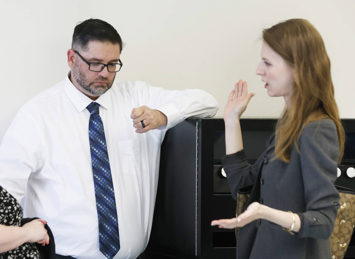 Robert Hutsell, center, a former employee at Never Give Up Youth Center, who is accused of sexu ...