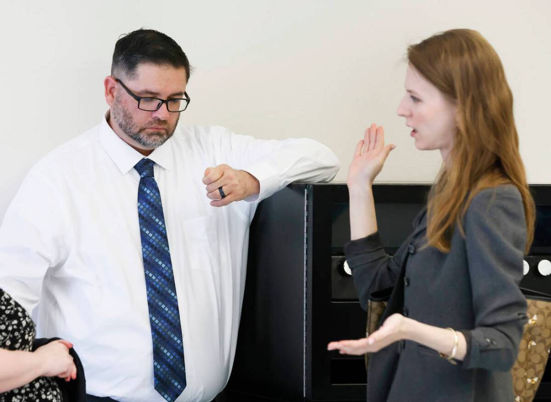 Robert Hutsell, center, a former employee at Never Give Up Youth Center, who is accused of sexu ...