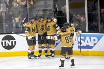The Golden Knights celebrate after Golden Knights center Jack Eichel (9) scored during the firs ...
