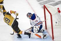 Golden Knights right wing Reilly Smith (19) scores on Edmonton Oilers goaltender Stuart Skinner ...