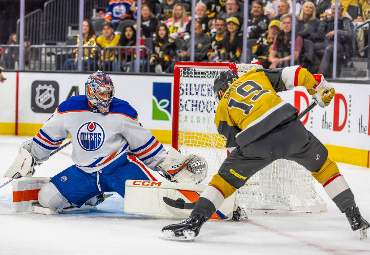 Golden Knights right wing Reilly Smith (19) attempts to shoot over the pad of Edmonton Oilers g ...