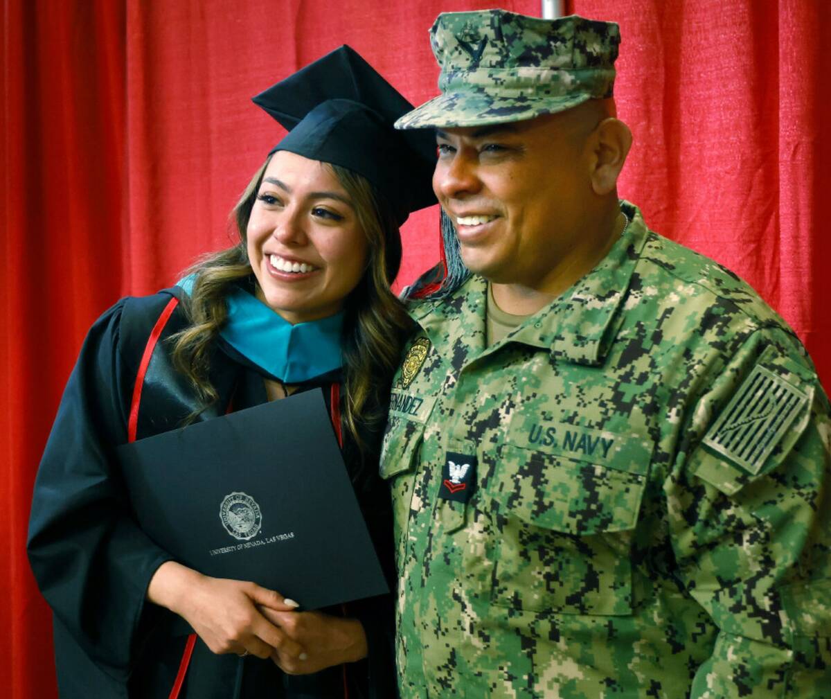U.S. Navy Petty Officer 2nd Class Douglas Hernandez and his daughter Pamela speaks to reporters ...