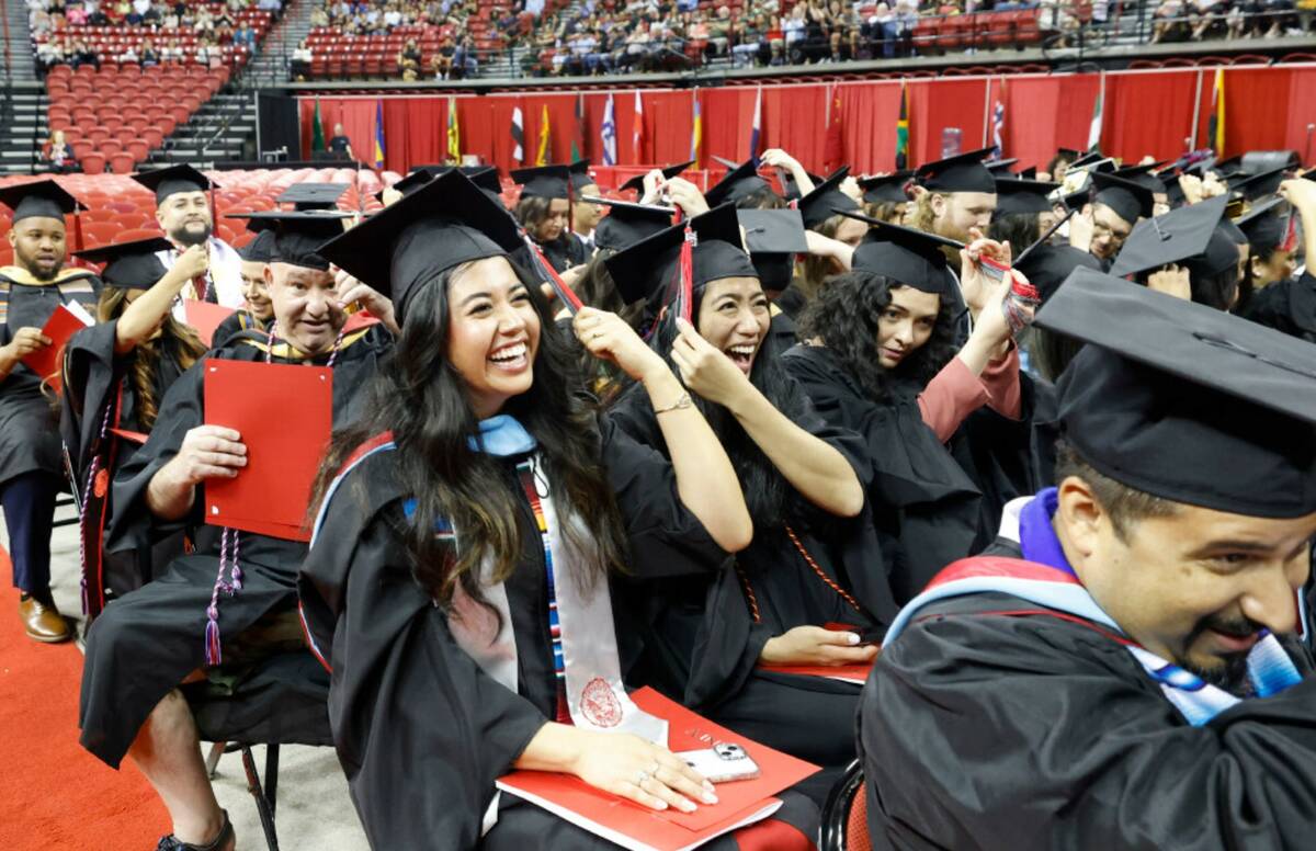 Graduates including Beatriz Adriana Romero, second from right,, Jamie Erin Mejia, next to Romer ...
