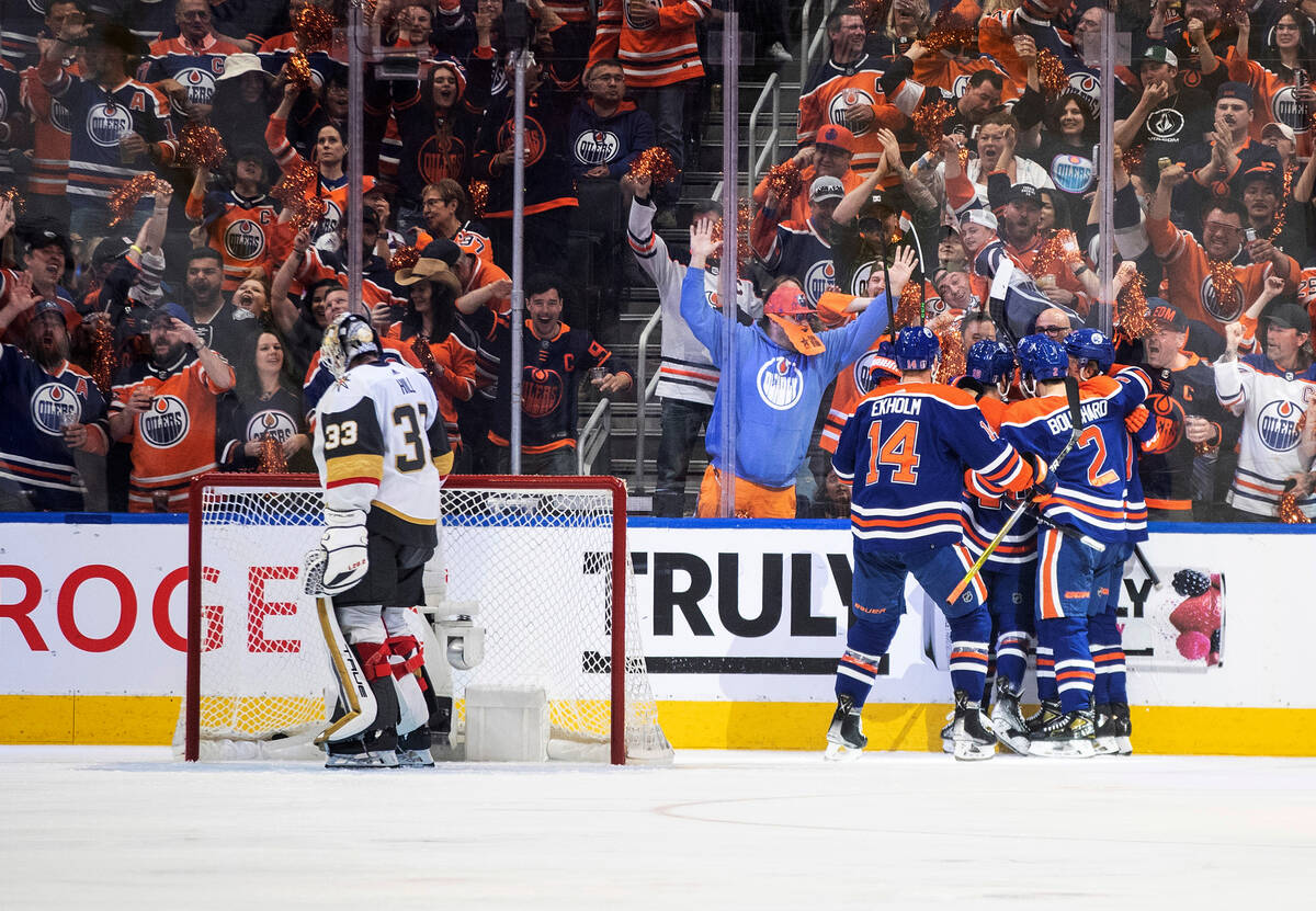 Vegas Golden Knights goalie Adin Hill (33) looks away as the Edmonton Oilers celebrate a goal d ...