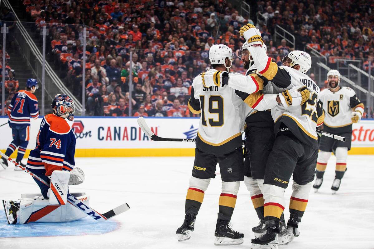 The Vegas Golden Knights celebrate teammate right wing Reilly Smith's goal on Edmonton Oilers g ...
