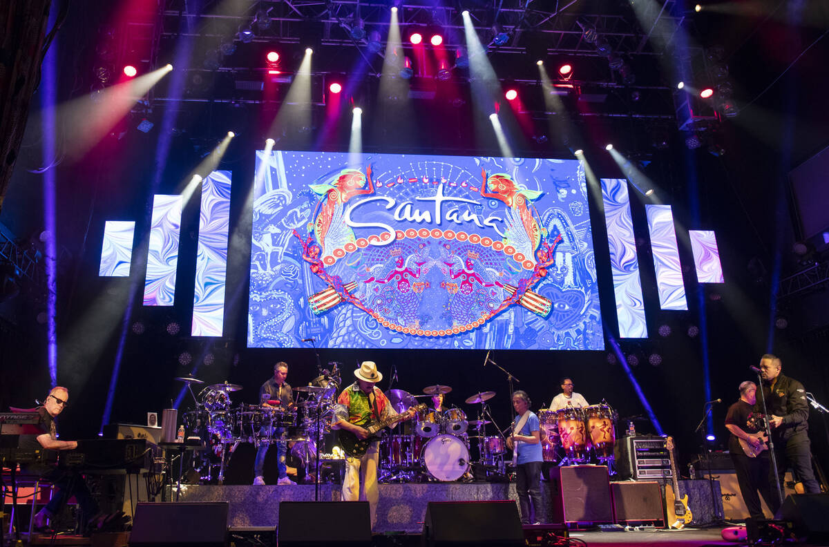 Carlos Santana performs a sound check after a press conference to announce an extension of Sant ...