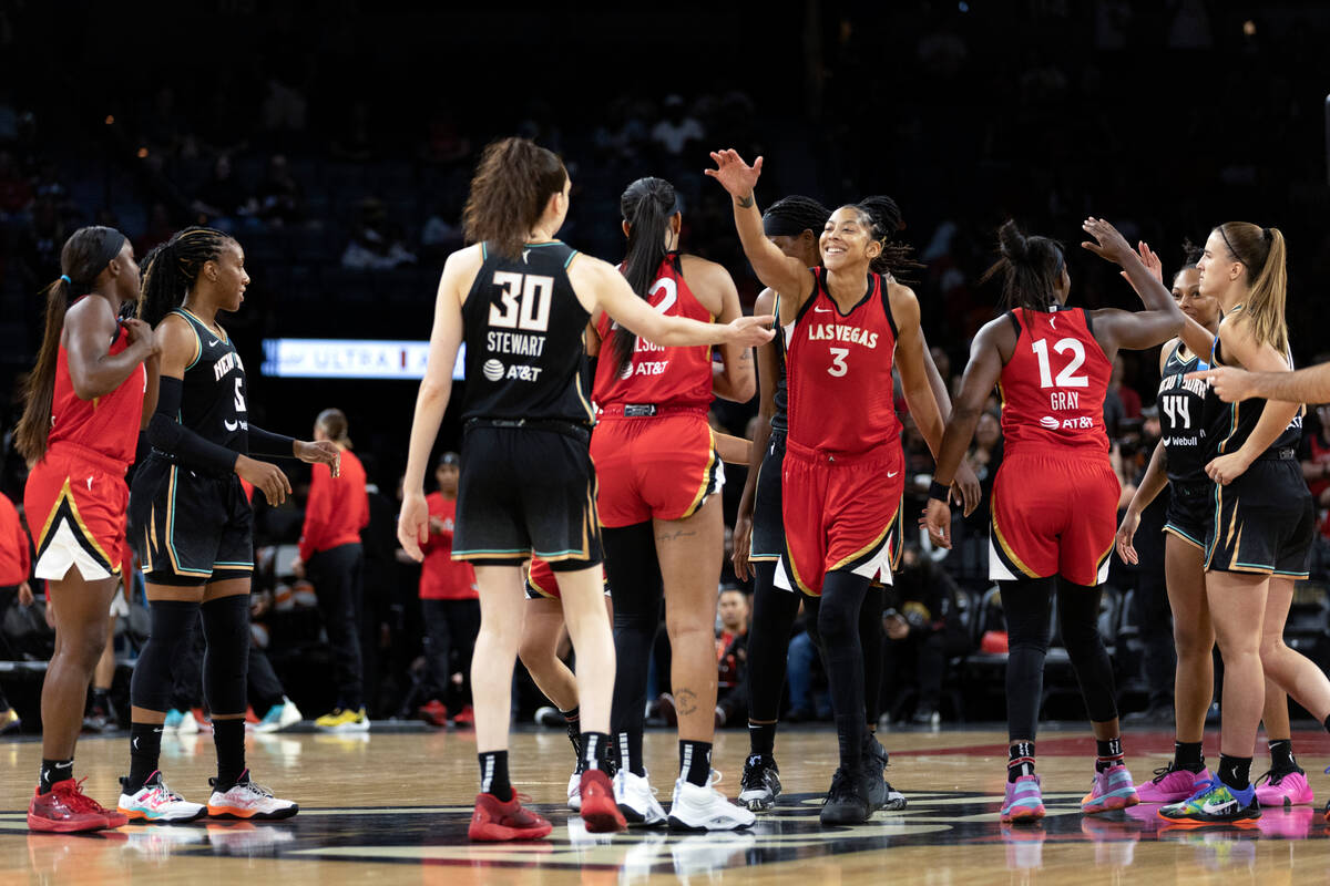 The Las Vegas Aces and the New York Liberty greet each other before a WNBA preseason basketball ...