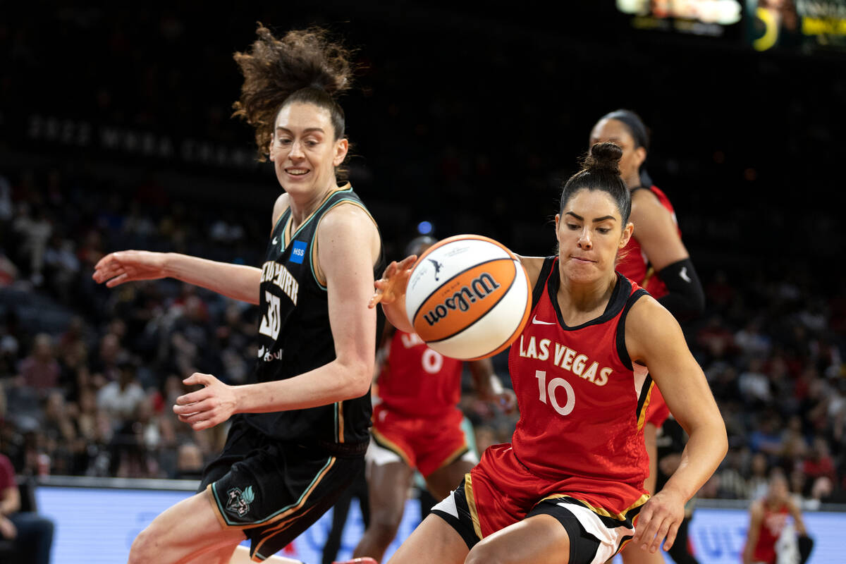 Aces guard Kelsey Plum (10) steals a pass intended for New York Liberty forward Breanna Stewart ...