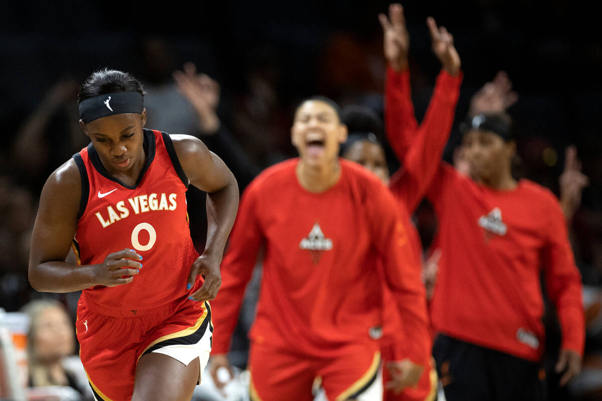 Aces guard Jackie Young (0) runs up the court after scoring a three-pointer during the first ha ...