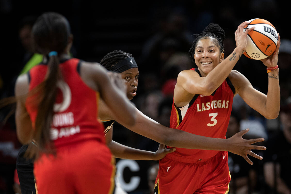 Aces forward Candace Parker (3) looks to pass to Aces guard Jackie Young (0) while New York Lib ...