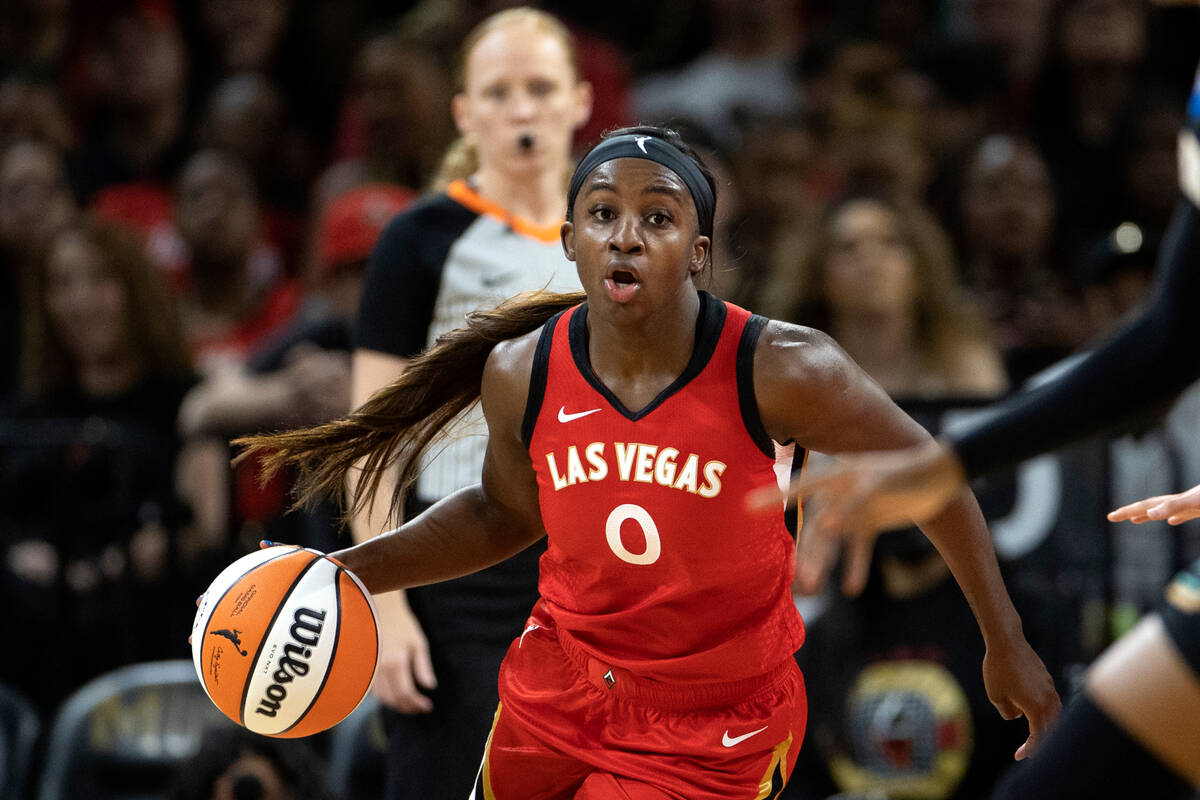Aces guard Jackie Young (0) dribbles up the court during the first half of a WNBA preseason bas ...