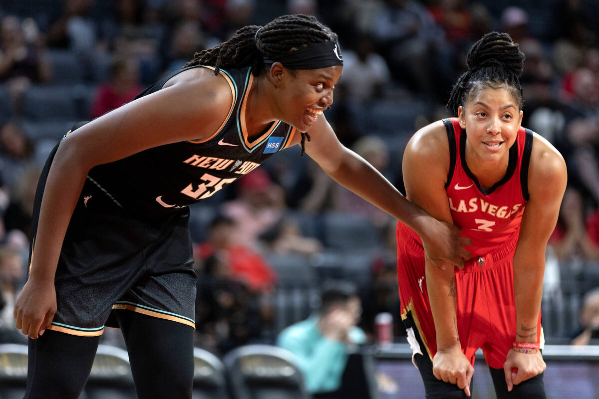 New York Liberty forward Jonquel Jones (35) and Aces forward Candace Parker (3) chat in between ...