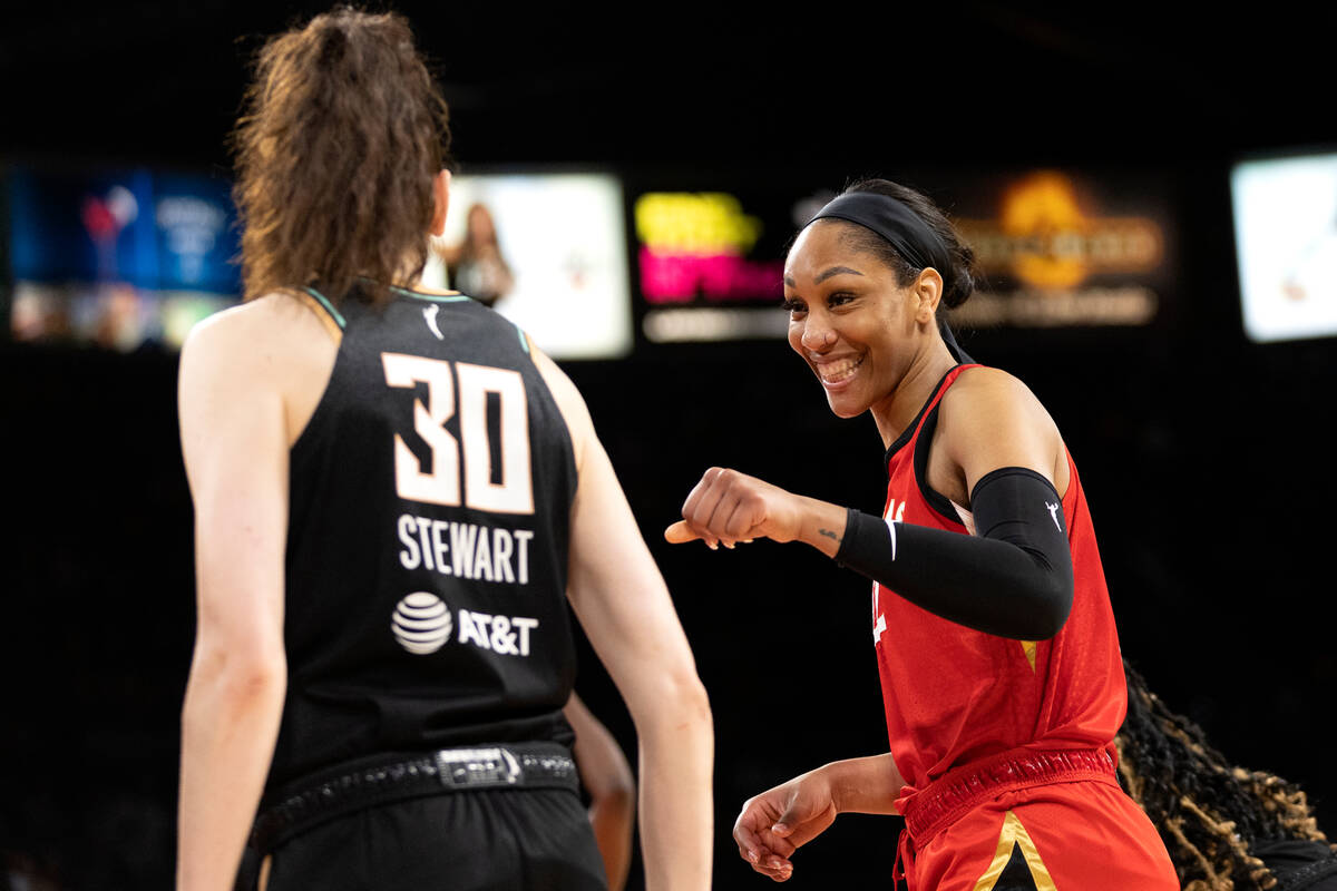 Aces forward A'ja Wilson (22) laughs with New York Liberty forward Breanna Stewart (30) during ...