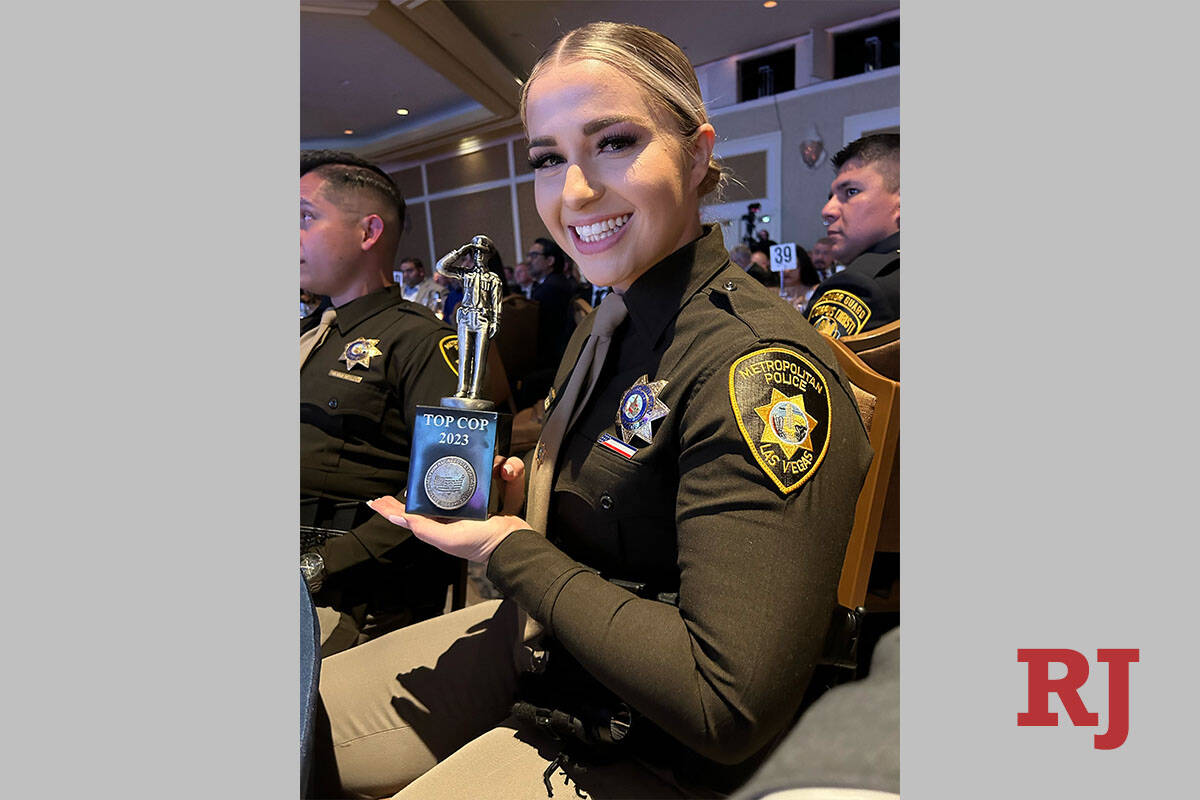 Metropolitan Police Department officer Tierney Tomburo with her Top Cop award Friday, May 12, 2 ...