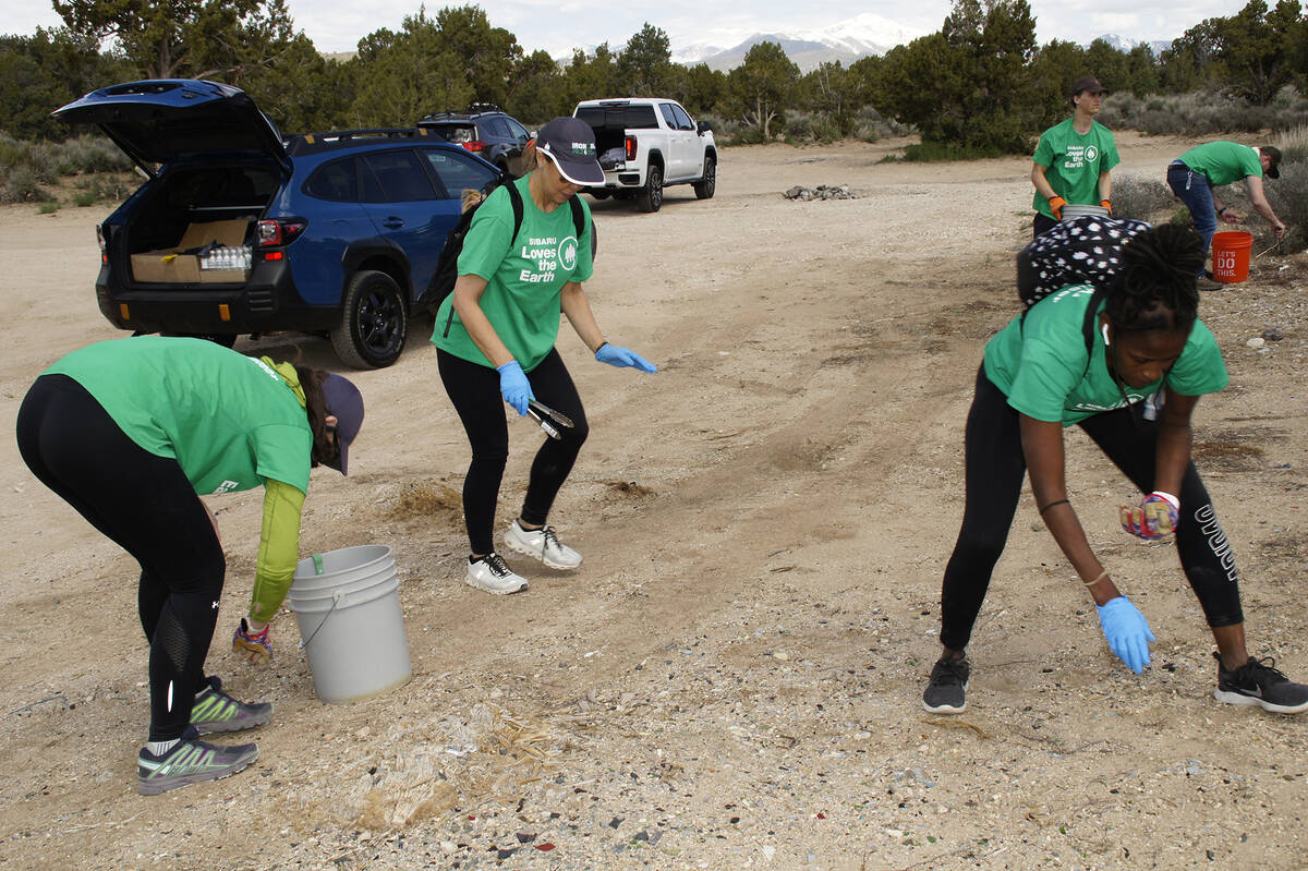 Centennial Subaru Love Promise employee volunteers help out cleaning up trash in the Lovell Can ...
