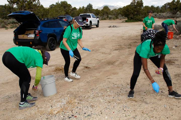 Centennial Subaru Love Promise employee volunteers help out cleaning up trash in the Lovell Can ...