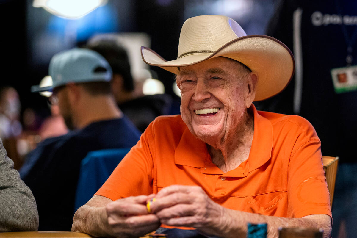 Legendary poker player Doyle Brunson joins others at a table during Day 1A of the $10,000 buy-i ...