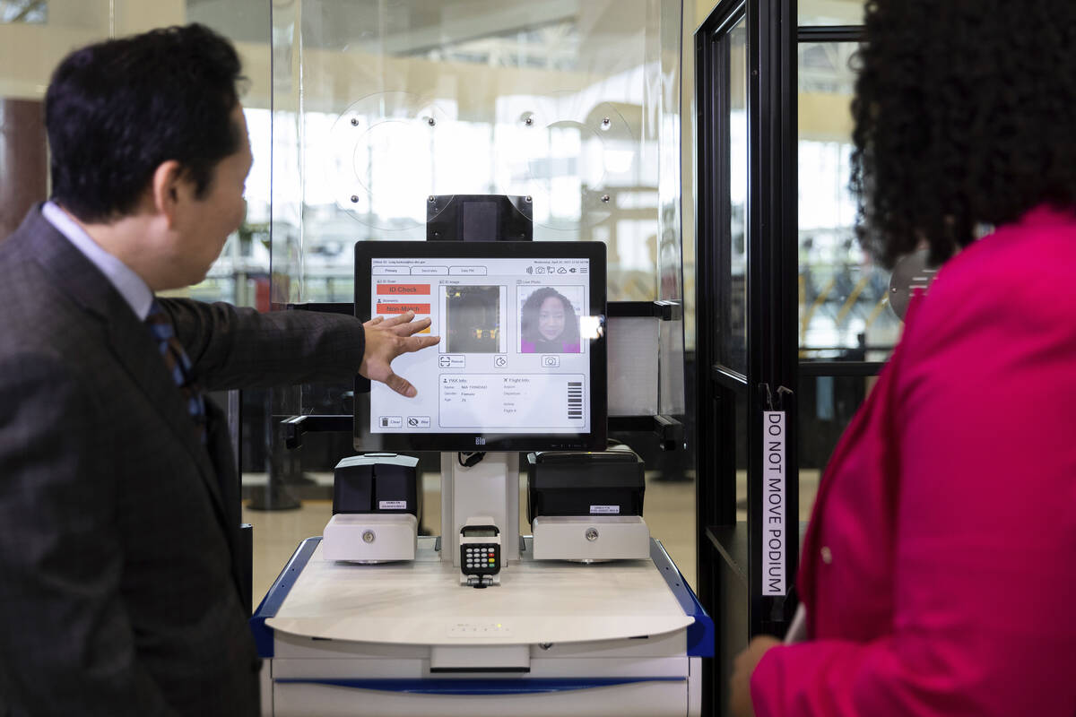 TSA's Jason Lim demonstrates new facial recognition technology at a Baltimore-Washington airpor ...