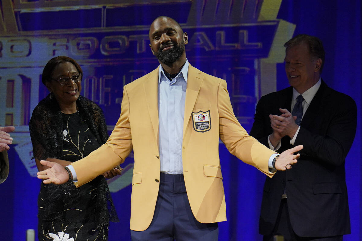 Charles Woodson, a member of the Pro Football Hall of Fame Class of 2021, receives his gold jac ...