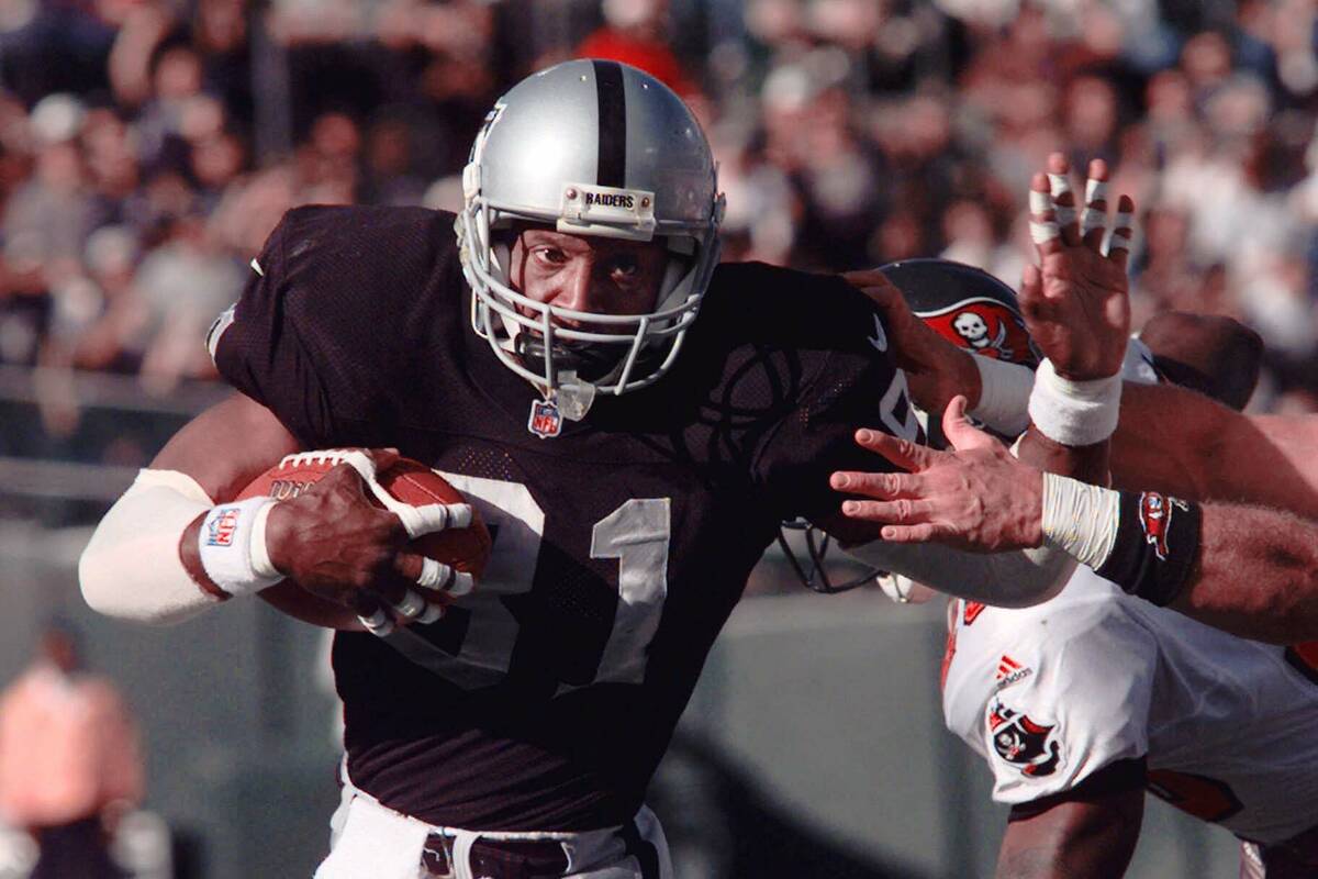 Oakland Raiders wide receiver Tim Brown scores in the first quarter against the Tampa Bay Bucca ...