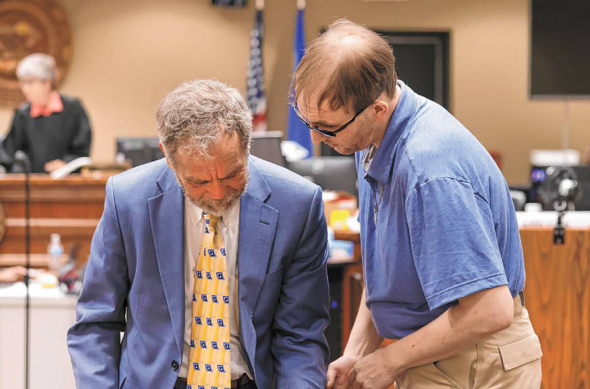 Brad Mehn, right, discusses with his attorney Thomas Gibson after attorneys delivered their clo ...
