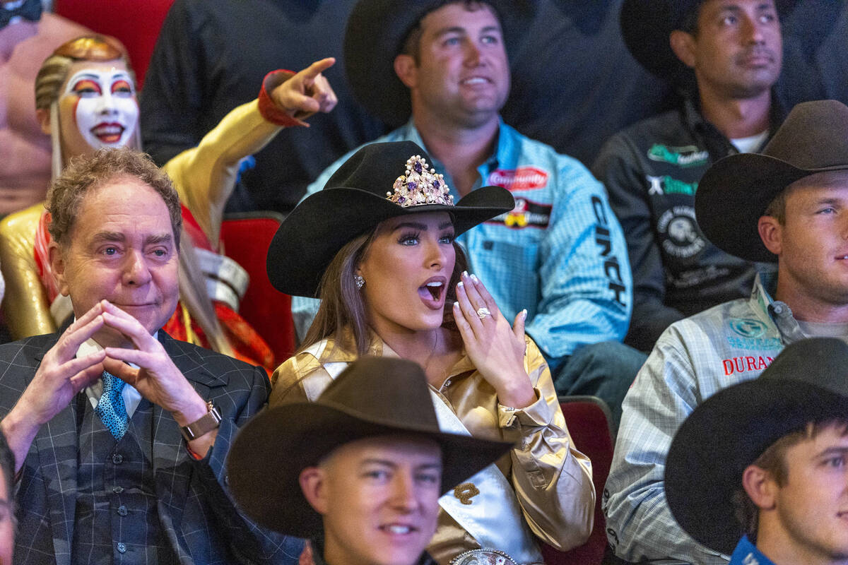 Miss Rodeo America Kennadee Riggs reacts for a photo beside Teller as they and 2022 NFR Champio ...