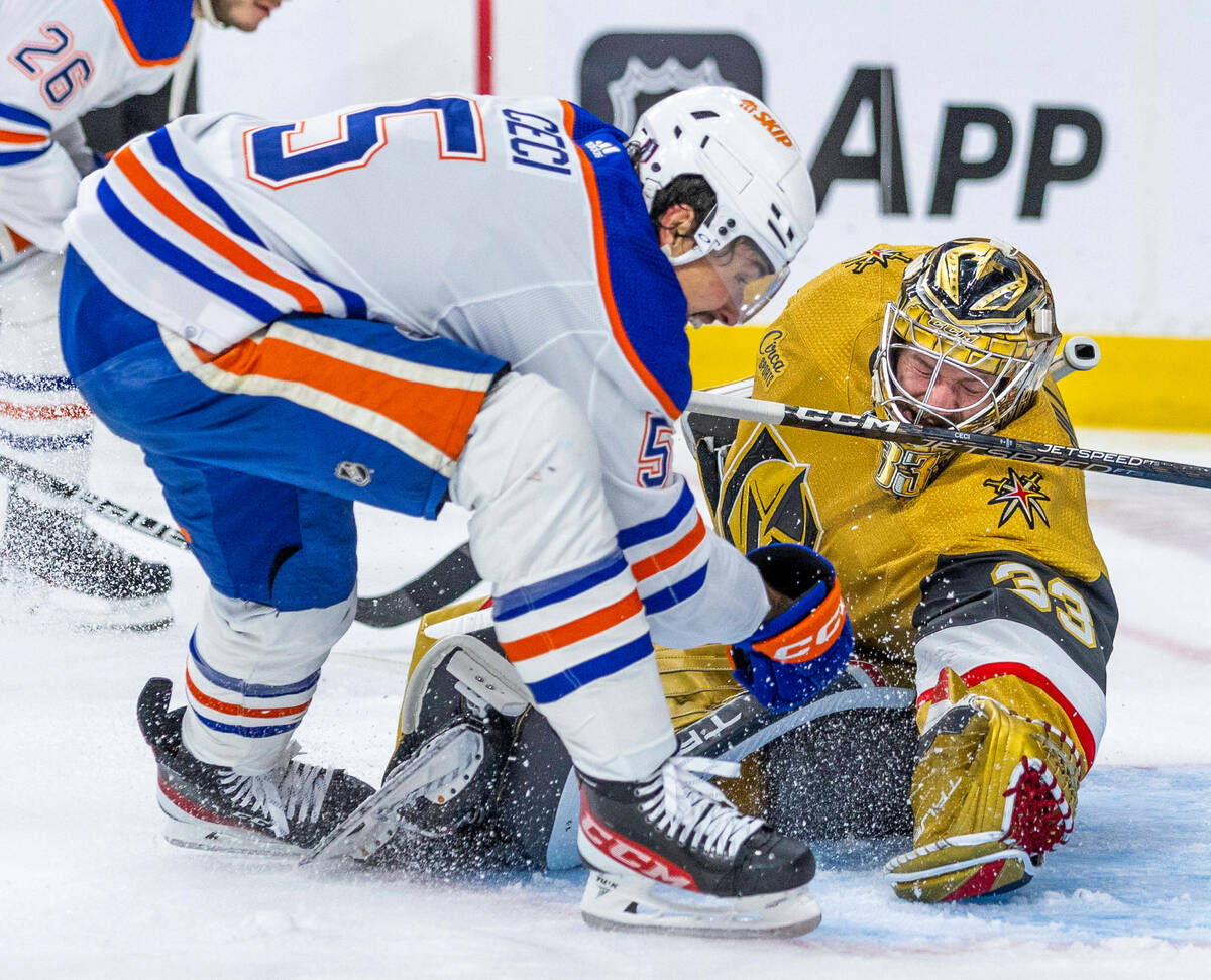 Golden Knights goaltender Adin Hill (33) rejects a shot attempt by Edmonton Oilers defenseman C ...