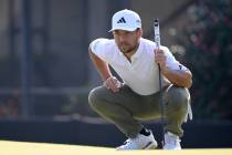 Xander Schauffele lines up his putt on the 15th green during the second round of the Arnold Pal ...