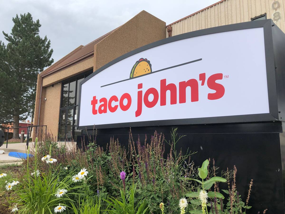 FILE - A sign stands outside the corporate headquarters of Cheyenne-based Taco John's on Aug. 1 ...