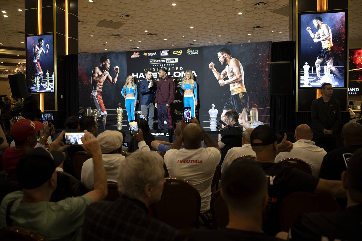 Devin Haney speaks with emcee Mark Shunock after arriving to MGM Grand ahead of his Saturday ni ...