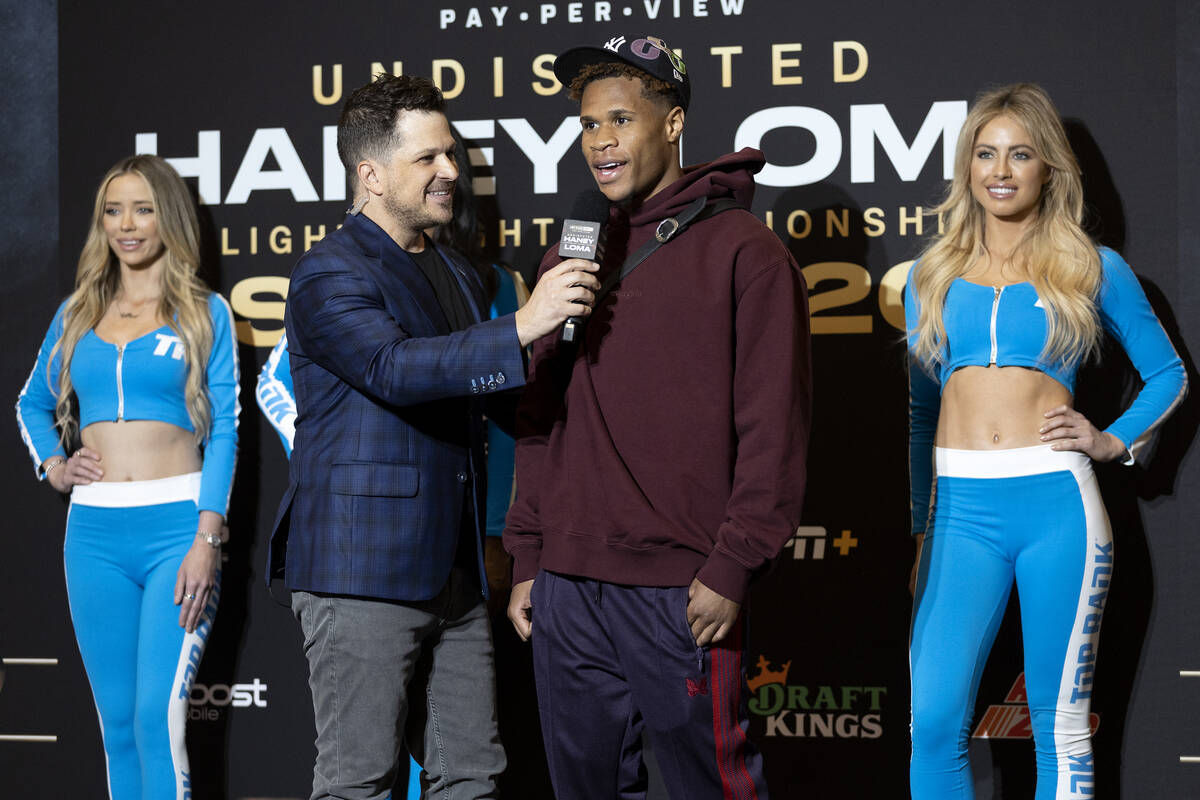 Devin Haney speaks with emcee Mark Shunock after arriving to MGM Grand ahead of his Saturday ni ...