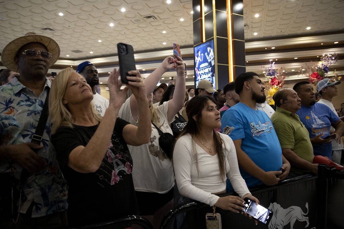 Fans get a glimpse of Vasily Lomachenko after he arrived to MGM Grand ahead of his Saturday nig ...