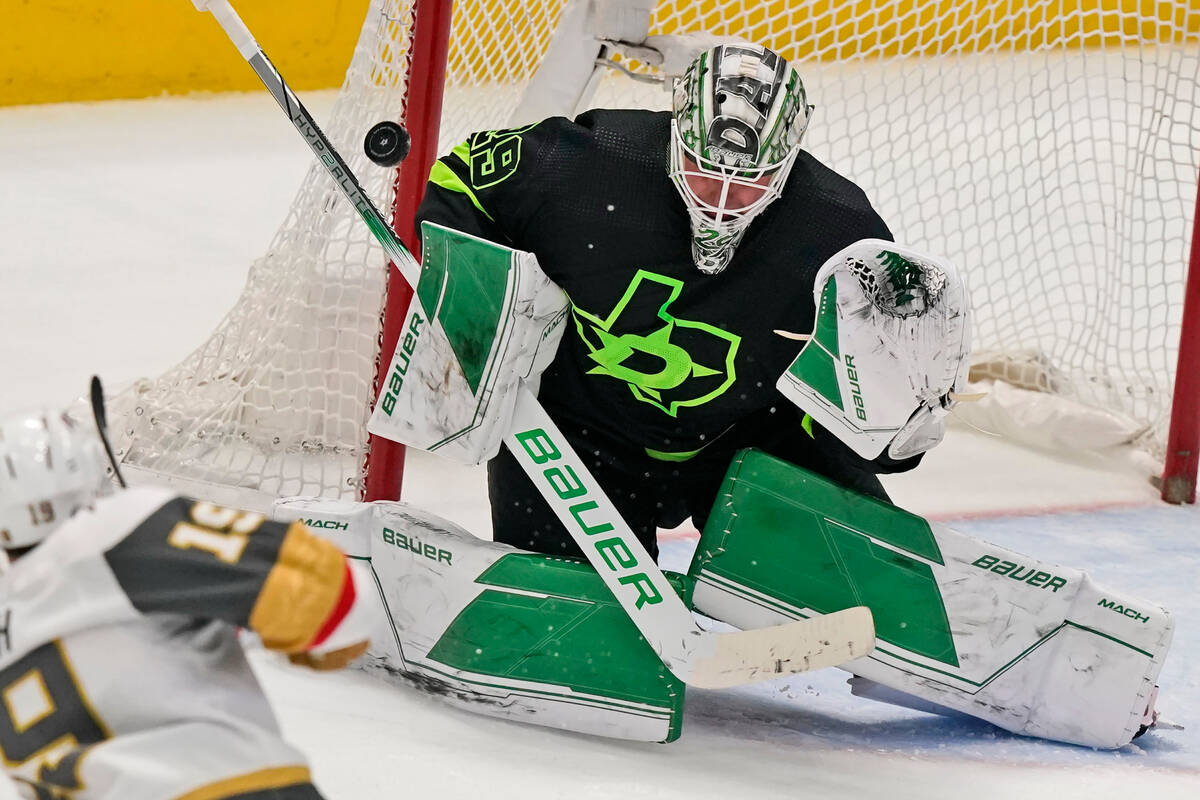 Dallas Stars goaltender Jake Oettinger (29) defends the goal during the third period of an NHL ...