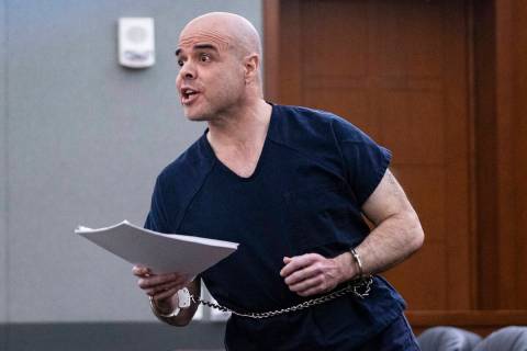 Former Clark County Administrator Robert Telles reacts after receiving court documents at the R ...