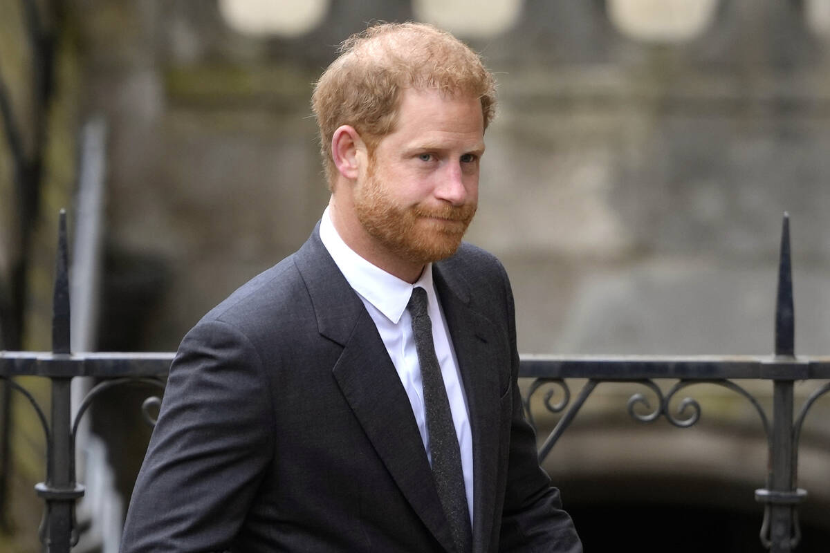FILE - Britain's Prince Harry arrives at the Royal Courts Of Justice in London, Thursday, March ...