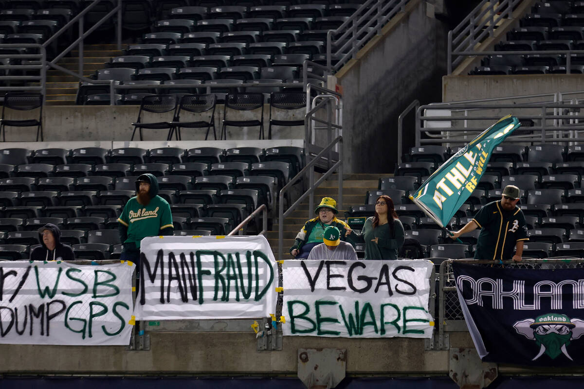Fans watch a baseball game between the Oakland Athletics and the Arizona Diamondbacks during th ...