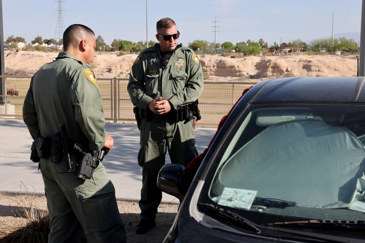 Members of Metropolitan Police Department’s Homeless Outreach Team, Angel Nunez, left, a ...