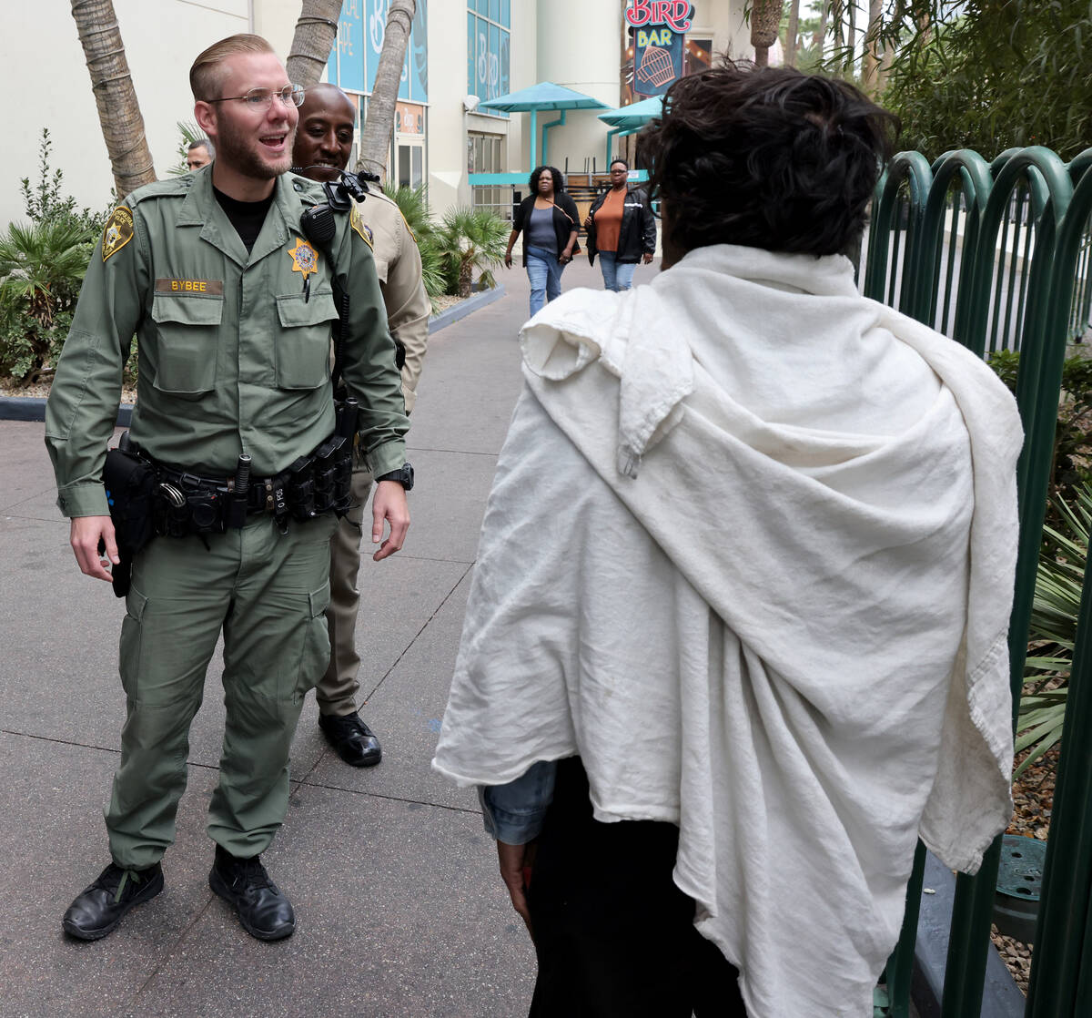 Metropolitan Police Department’s Homeless Outreach Team member, Officer Baron Bybee, tal ...