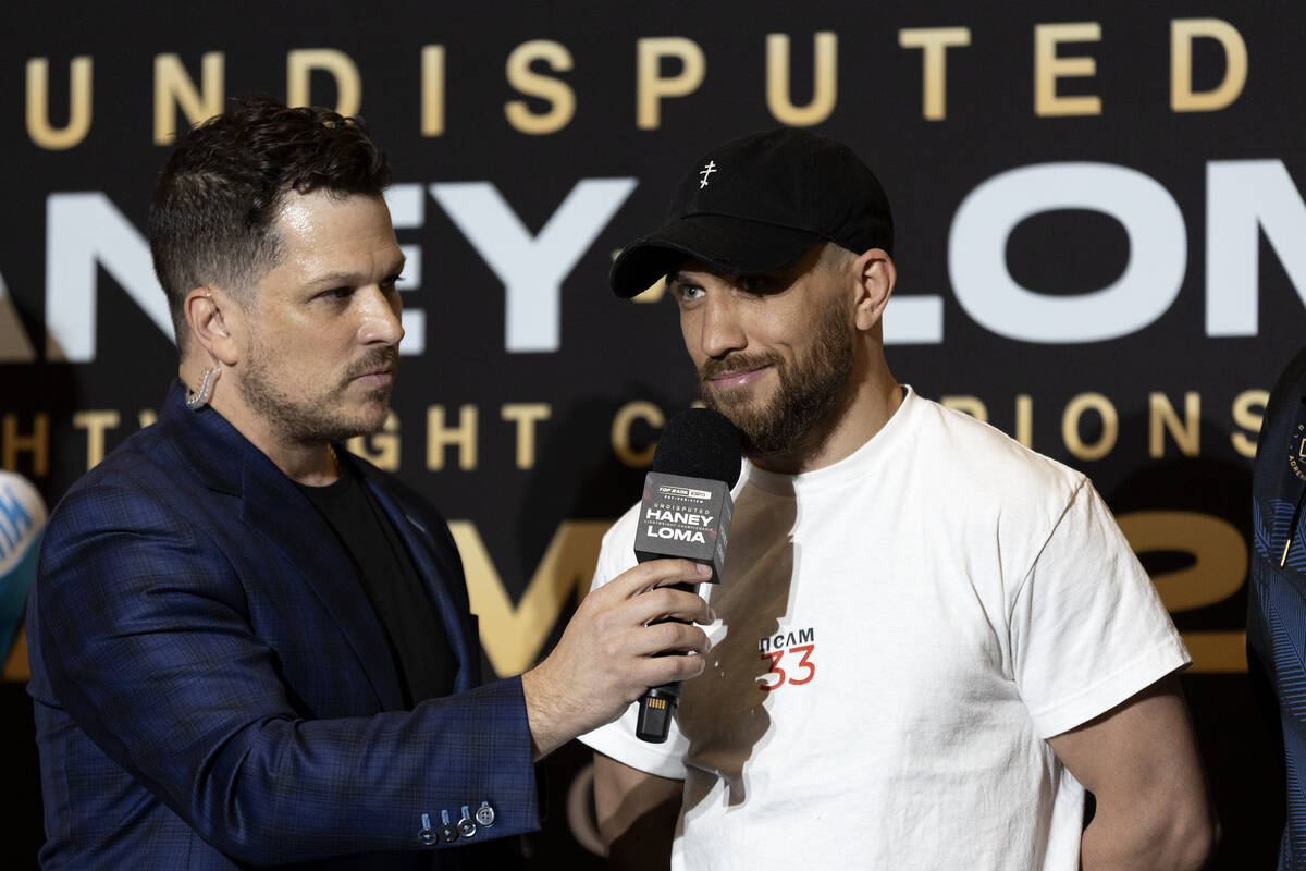 Vasily Lomachenko speaks with emcee Mark Shunock after arriving to MGM Grand ahead of his Satur ...