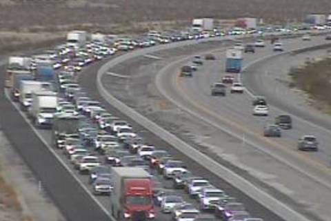 This picture taken from video shows traffic backed up on Interstate 15 southbound near Primm on ...
