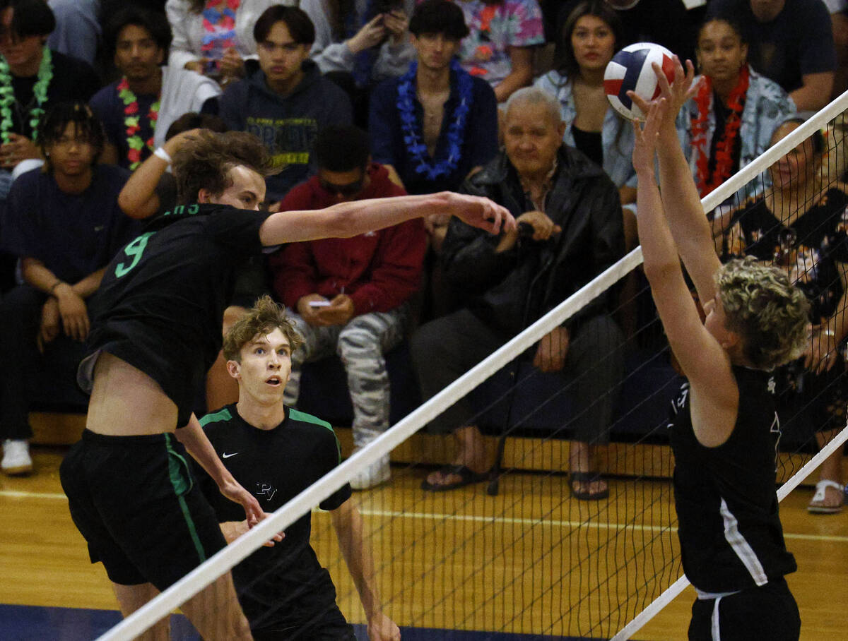 Shadow Ridge's Tyler Kirk (7), right, blocks a spike by Palo Verde's Gavin Nelson (9), left, as ...