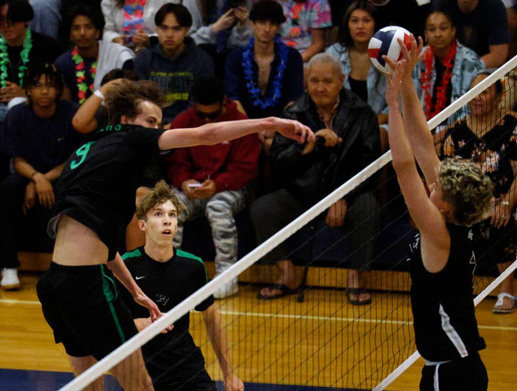 Shadow Ridge's Tyler Kirk (7), right, blocks a spike by Palo Verde's Gavin Nelson (9), left, as ...