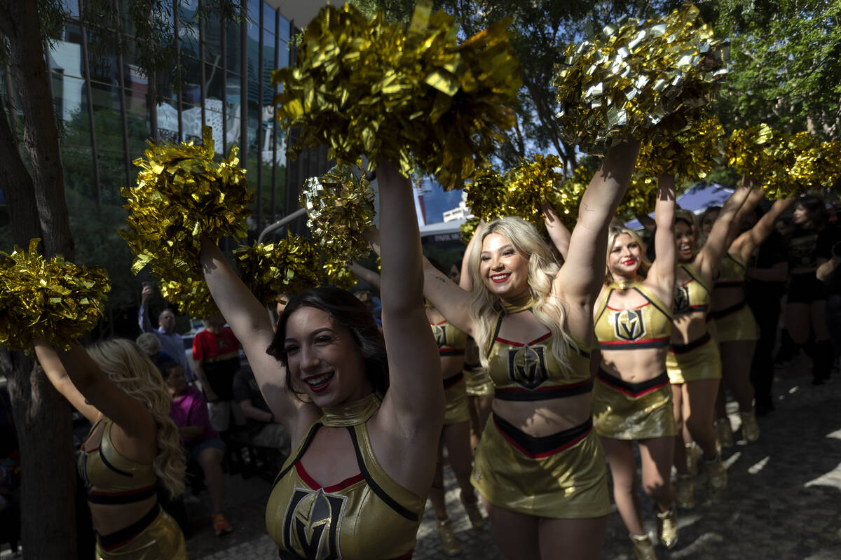 The Vegas Vivas cheer as they parade through the fan zone before Game 1 of the Western Conferen ...