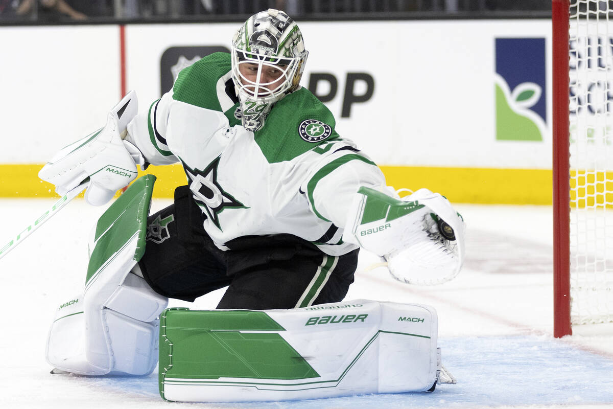Dallas Stars goaltender Jake Oettinger (29) saves the puck during the first period in Game 1 of ...