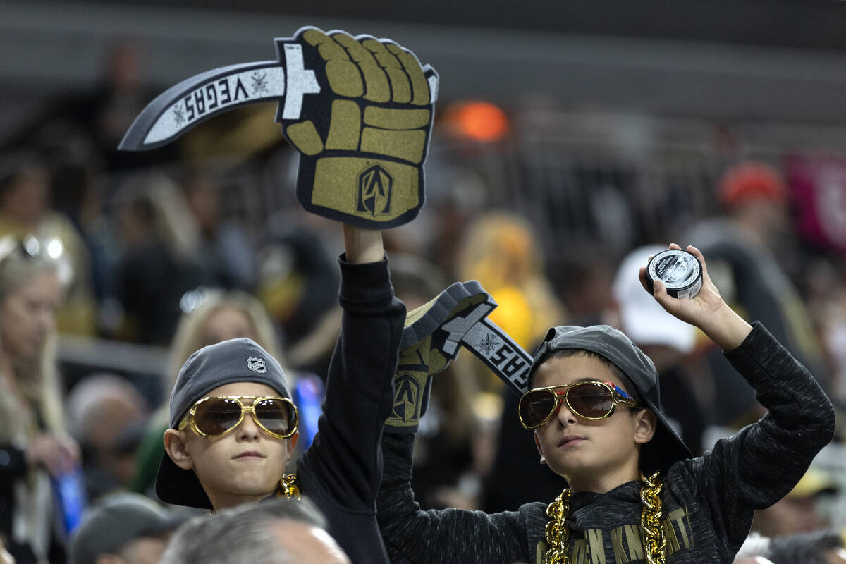 Young Golden Knights fans cheer for their team during the second period in Game 1 of a NHL hock ...