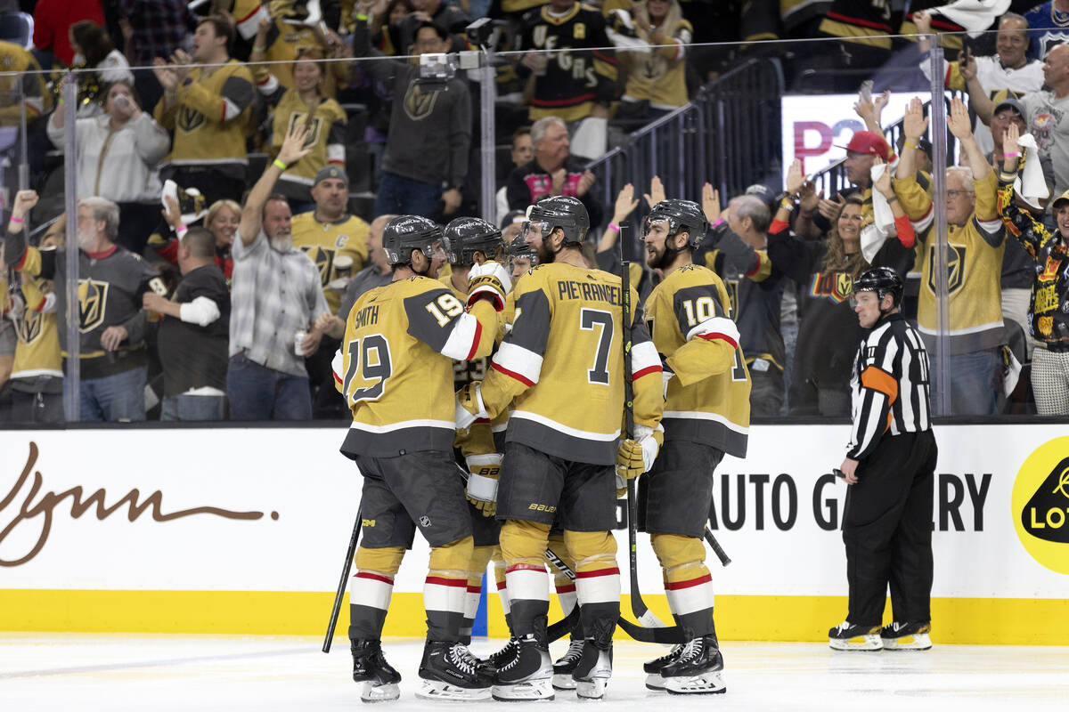 The Golden Knights celebrate after center William Karlsson (71) scored his second goal of the g ...