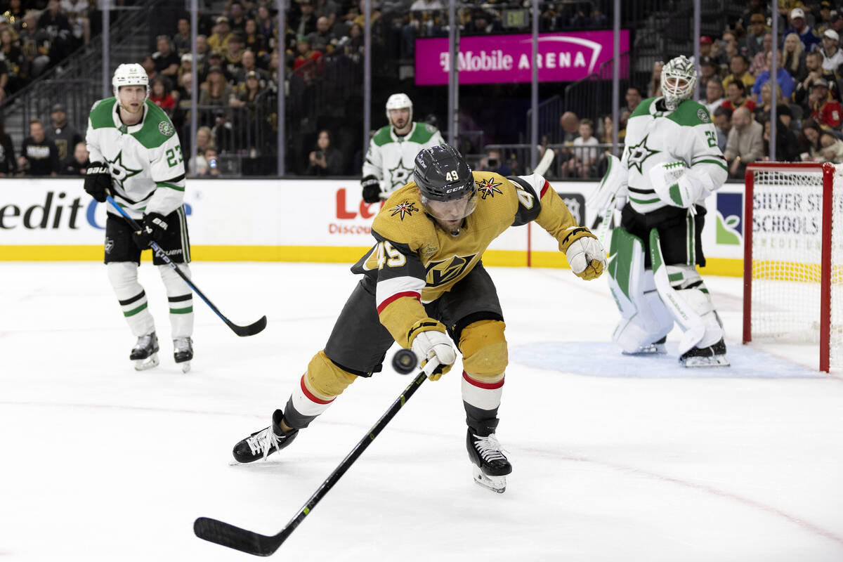Golden Knights center Teddy Blueger (53) reaches for a loose puck during the third period in Ga ...